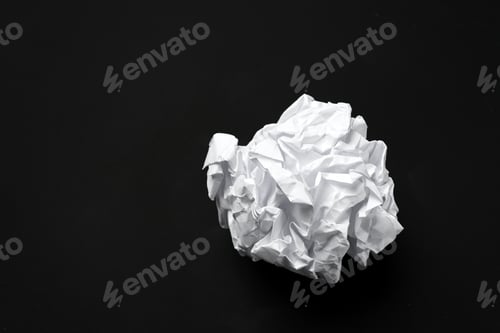 Preview: Crumpled White Paper Ball on Black Background