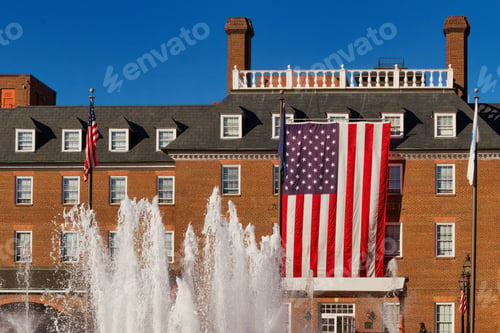 Preview: Exterior shot of the United States flag hanging on City Hall in Old Town Alexandria, Virginia