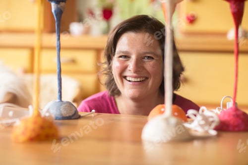 Preview: Woman proud of her paper lamp