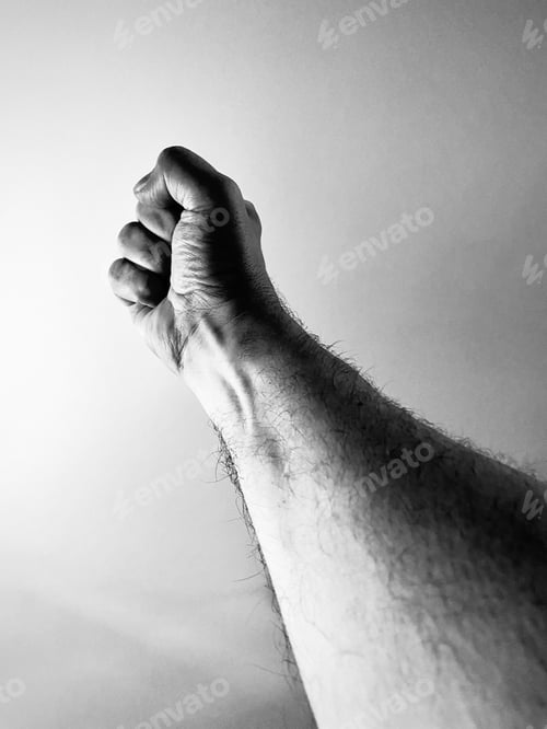 Preview: Raised male arm and fist
