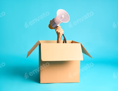 Preview: Hand with megaphone raised from cardboard box