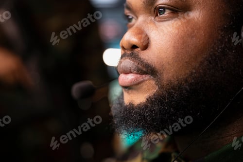 Preview: Officer relaying instructions to squadrons patrolling over borders using mic