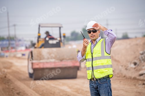 Preview: Construction engineer wear safety uniform under inspection and survey workplace by radio Commucation