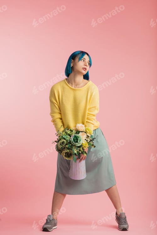Preview: crazy girl with flowers and vase having fun