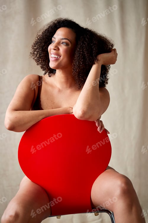 Preview: Studio Shot Of Confident Natural Woman In Underwear Promoting Body Positivity Sitting On Chair