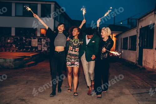 Preview: Group of friends enjoying out with sparklers