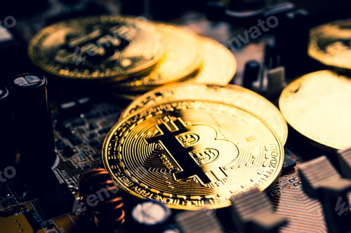 Preview: Golden coins with bitcoin symbol on a mainboard.