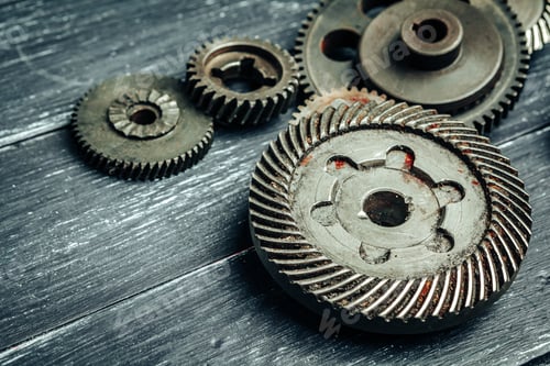 Preview: Car parts gears and bearings on wooden background