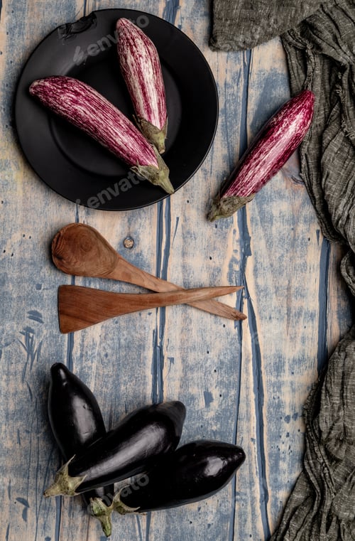 Preview: Ripe eggplants on shabby tabletop