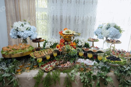 Preview: Vibrant fruit and flower display at an elegant event