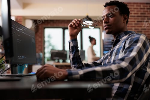 Preview: Pensive network engineer reflecting at failed data processing operation