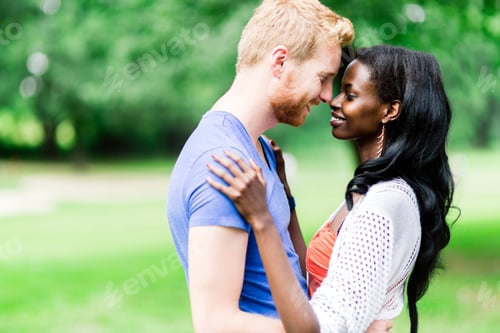 Preview: Couple in love hugging and kissing peacfully outdoors