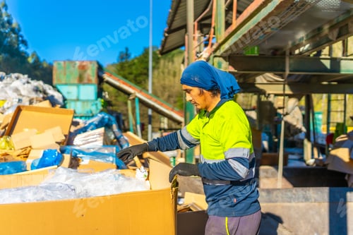 Preview: Worker cataloging materials and separating them in a recycling plant