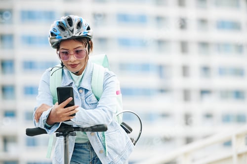 Preview: Female courier checking notifications