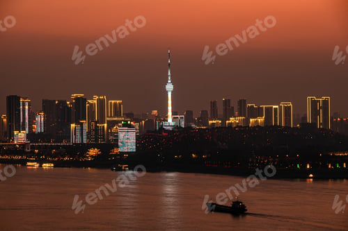 Preview: Night, by the Yangtze River, under the sunset, skyscrapers in Wuhan are illuminated
