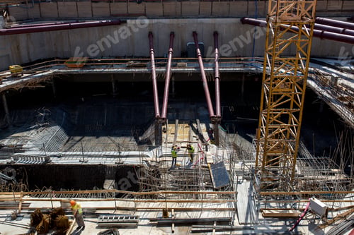 Preview: People working at a building construction site.