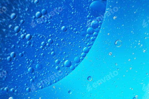 Preview: abstract light blue background with oil circles . bubbles of water close up .