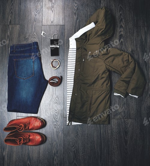 Preview: Ready for the weekend. High angle shot of a casual outfit on a wooden outfit.