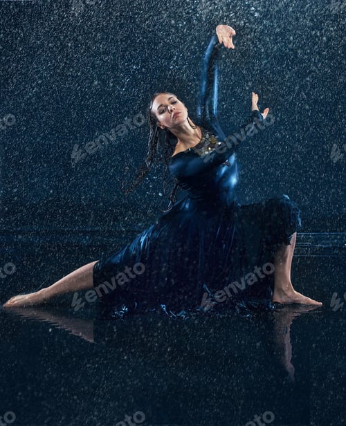 Preview: The young beautiful modern dancer dancing under water drops