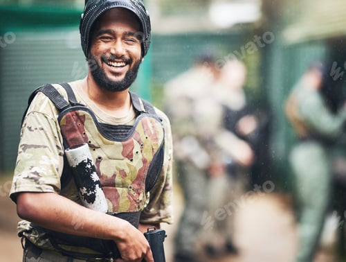 Preview: Happy, portrait or man with paintball gun in games arena, team competition or sports challenge in m