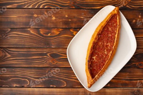 Preview: Pide - Turkish baked bread on wooden table