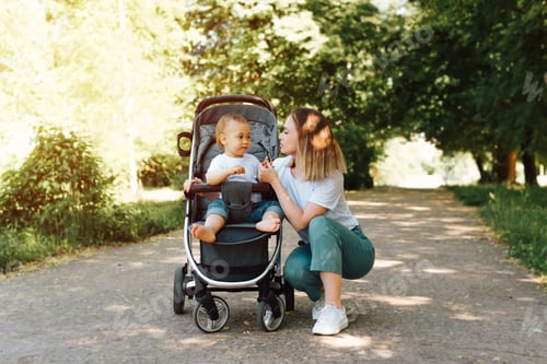 Preview: Mother and Baby Strolling in the Park
