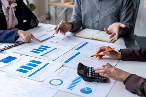 Preview: Team Analyzing Data at a Table Indoors