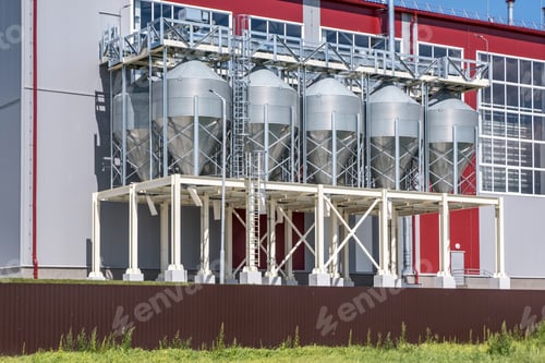 Preview: Modern Granary elevator. Silver silos on agro-processing and manufacturing plant