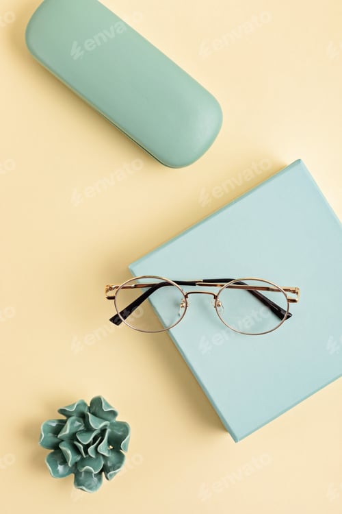 Preview: Stylish eyeglasses over pastel background. Optical store, glasses selection, eye test, vision