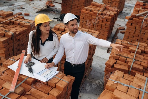 Preview: Female manager and male builder are on the construction site