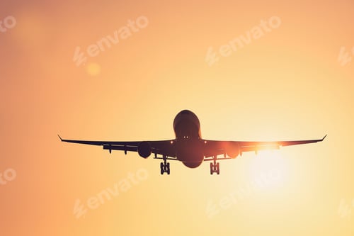 Preview: Airplane landing at sunset