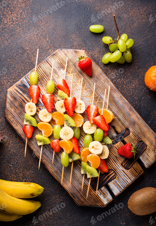 Preview: Colorful Fruit Skewers on a Wooden Cutting Board