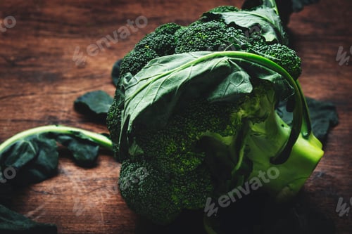 Preview: Fresh organic broccoli cabbage on old rustic wooden kitchen table background,