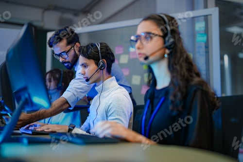 Preview: A diverse team of professionals works at a customer support call center.
