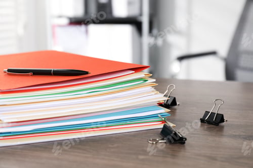 Preview: Many folders with documents, pen and binder clips on wooden desk, closeup