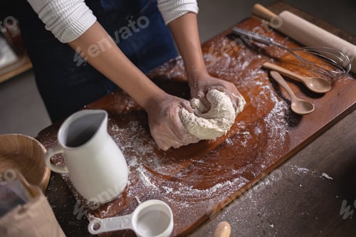 Preview: Close up Hand of baker chef is making with flour loaf of dough