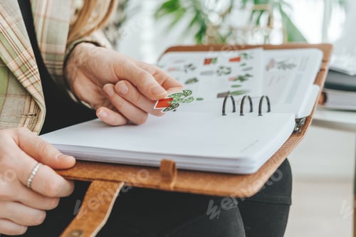 Preview: woman hands with plants stickers and notebook, education, working from home
