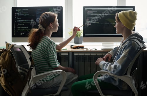 Preview: Teen Boy And Girl Working On Code In Class