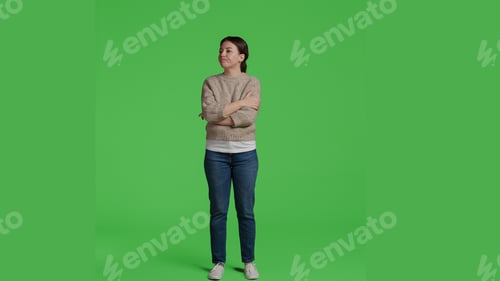Preview: Front view of woman sitting curious and impatient in studio