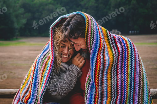 Preview: Intimate funny and happy moments with adult couple in outdoor leisure activity covered