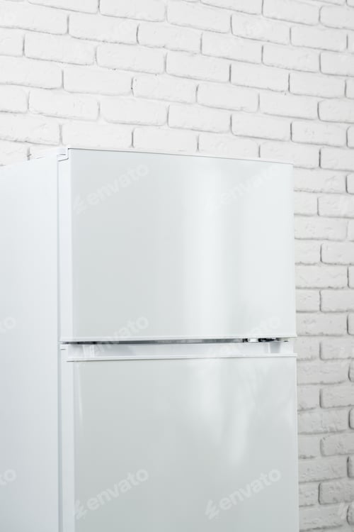Preview: White Refrigerator In A Modern Kitchen With Brick Wall