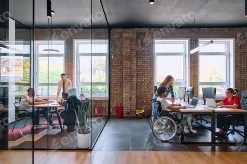 Preview: A diverse group of business professionals collaborates in a modern startup coworking center
