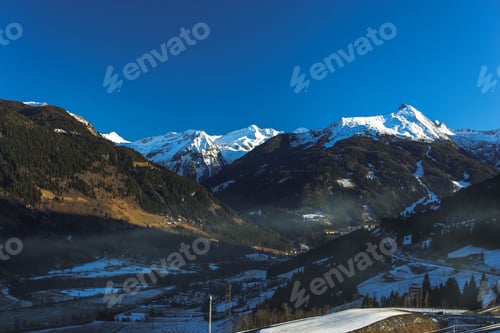 Preview: Snow-Capped Mountains in a Serene Valley