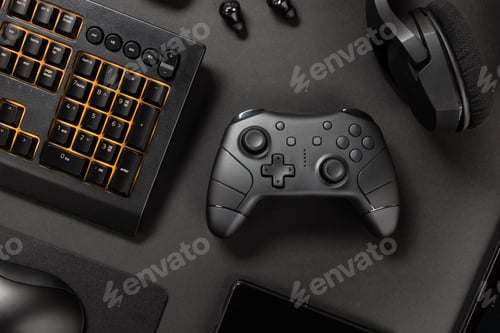 Preview: Orange lit keyboard with controller amidst various wireless devices