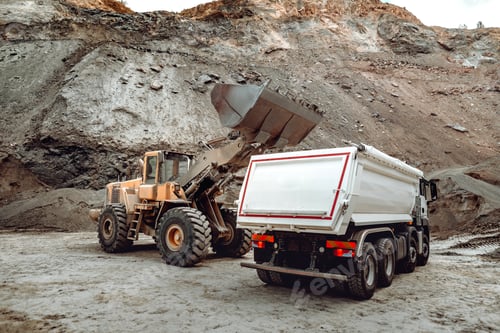 Preview: Industrial dumper trucks and wheel loader bulldozer working on highway construction