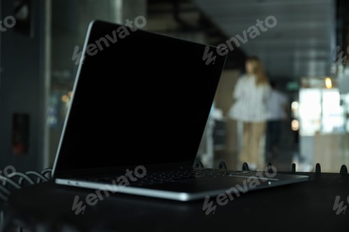 Preview: Laptop on office table close-up, side view