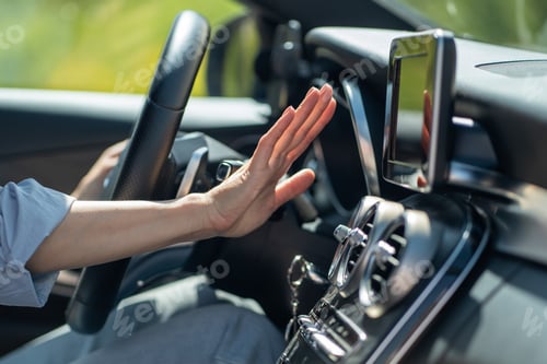 Preview: Female hand checks flow of cold air from air conditioner inside car, suffer from heat in vehicle