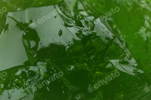 Preview: Delicious kiwi jelly on whole background, close up