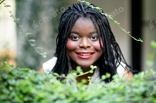 Preview: Portrait of young afro black girl posing outdoor.
