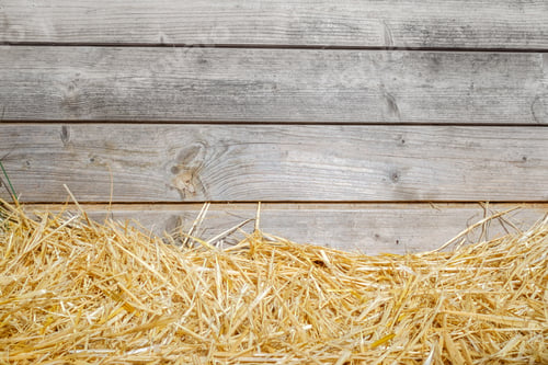Preview: Natural background of wooden boards with rural straw and copy space.